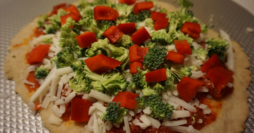 Gluten-free pizza with broccoli and red pepper