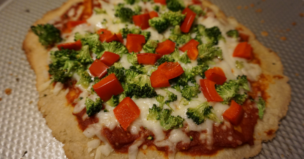 Gluten-free pizza with broccoli and red pepper