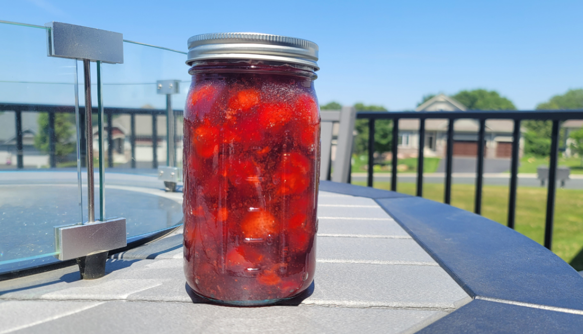 Strawberry pie filling on a table outside